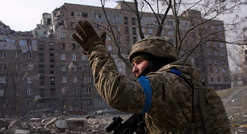 A Ukrainian serviceman seen guarding his position in Mariupol, Ukraine, on March 12.