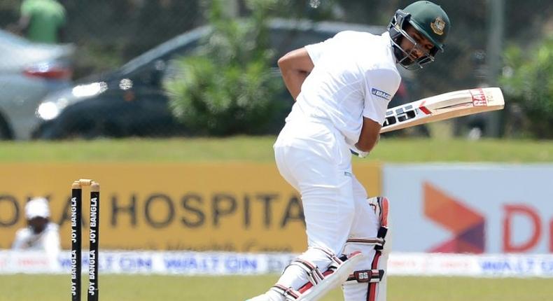 Bangladesh batsman Mahmudullah Riyad looks back at his shattered wicket after his dismissal by Sri Lankan bowler Lahiru Kumara during the first Test against Sri Lanka in Galle on March 9, 2017