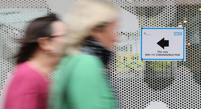 A sign directs directs patients to an NHS 111 Coronavirus Pod testing service area for COVID-19 assessment at University College Hospital in London on March 5, 2020.ISABEL INFANTES:AFP via Getty Images)