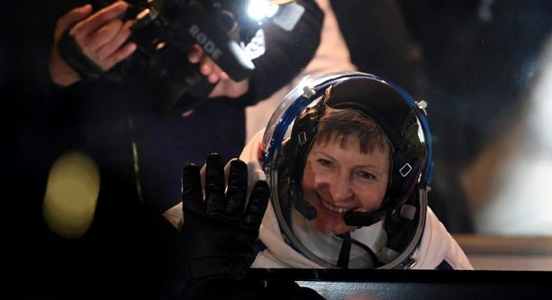 US astronaut Peggy Whitson waves to the crowd at the Russian-leased Baikonur Cosmodrome in November 2016