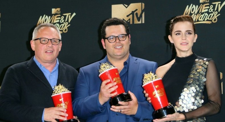 Director Bill Condon (L) and actors Josh Gad (C) and Emma Watson (R), winners of Movie of the Year for 'Beauty and the Beast' at the MTV Movie & TV Awards