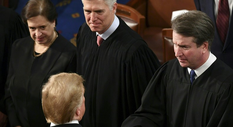 US President Donald Trump greets US Supreme Court Justice Brett Kavanaugh (R) following his State of the Union address at the US Capitol in Washington, DC, on February 5, 2019.Mandel Ngan/AFP via Getty Images