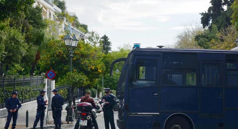 Police check the identity of a man near the prime minister's and president's offices in Athens on November 14, 2016 as part of the security measures set ahead of the visit of outgoing US president Barack Obama