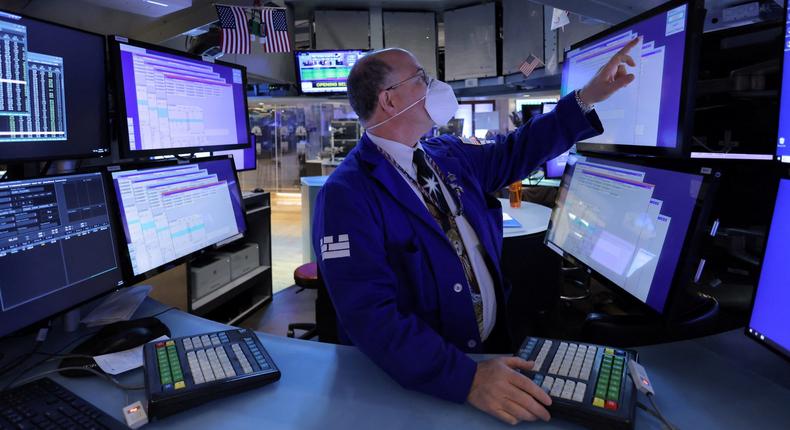 A trader works on the trading floor on the last day of trading before Christmas at the New York Stock Exchange (NYSE) in Manhattan, New York City, U.S., December 23, 2021.