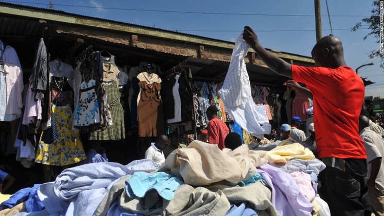 A man selling used or thrift clothes {wealthresult}