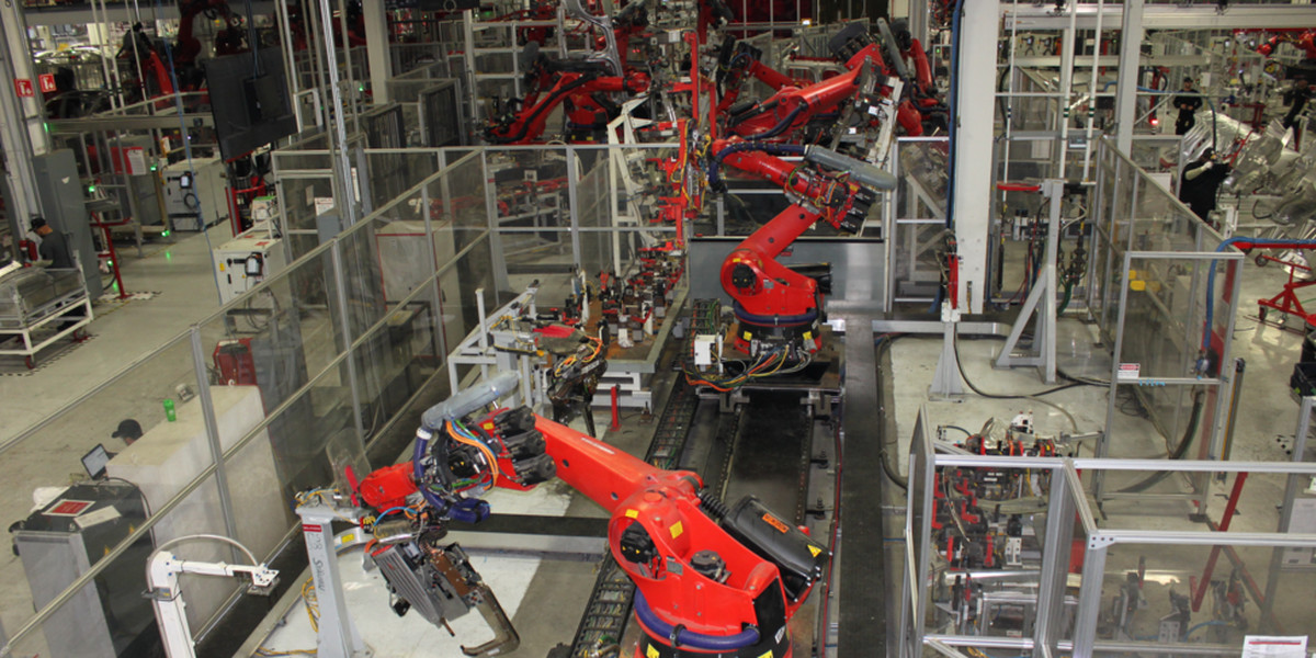 Robots building Teslas.