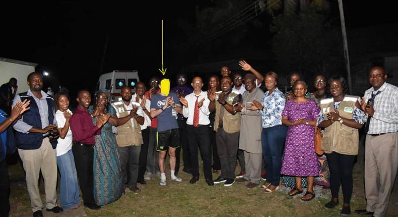 Nigeria's index coronavirus patient, Italian (in shorts) is waved on by health workers and Lagos government officials (Twitter: @jidesanwoolu)