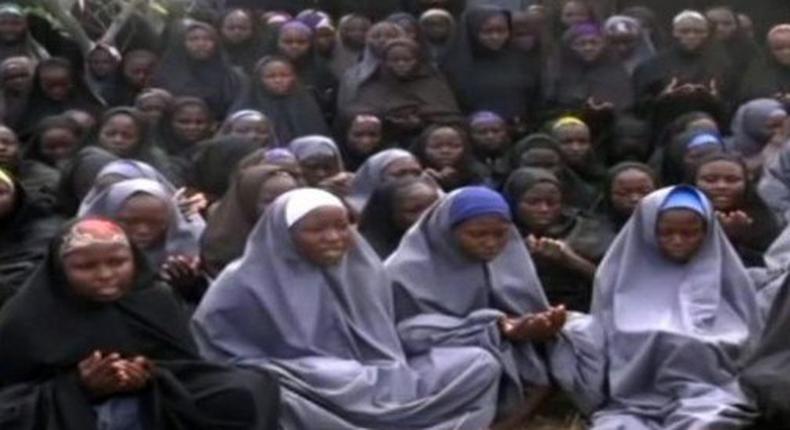 Kidnapped Chibok schoolgirls wearing the full-length hijab and praying at an undisclosed rural location.