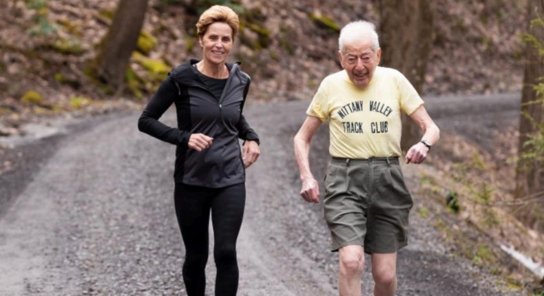 Personal trainer Lauren Hurst and 98-year-old runner George Etzweiler.Lauren Hurst