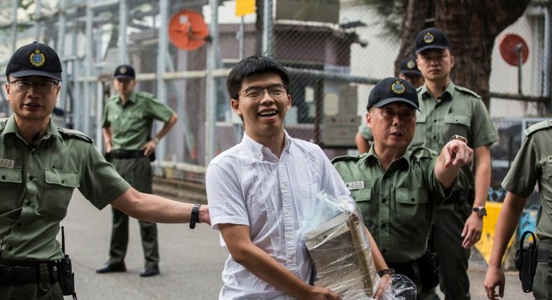 Hong Kong democracy activist Joshua Wong smiled as he walked free from prison