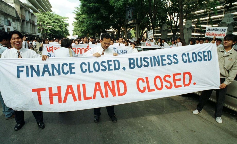 Employees of suspended finance companies during a rally outside the Bank of Thailand in Bangkok on November 12. Hundreds of disgruntled employees who were either laid off or about to lose their jobs urged the central bank to take responsibility for their plight.