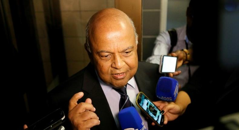 South African finance minister Pravin Gordhan speaks with journalists outside of the High Court on March 28, 2017 in Pretoria