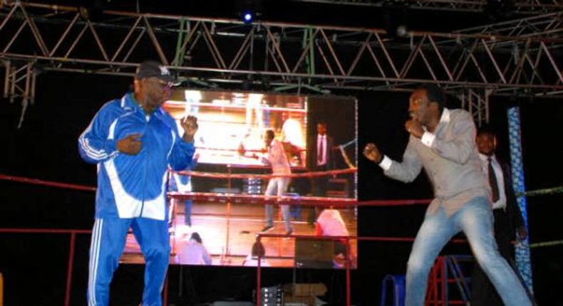 Obasanjo showing his boxing capabilities with Bovi