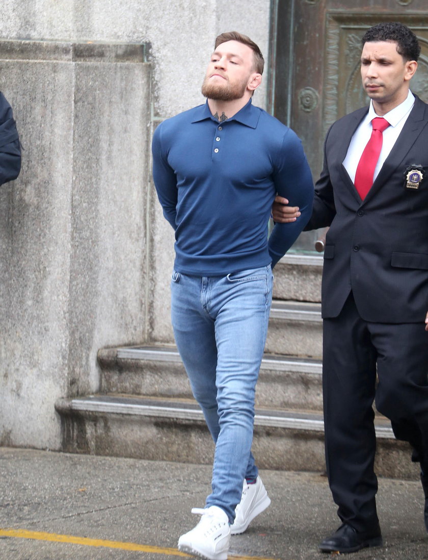 Conor McGregor led out of NYPD's 78th Precinct