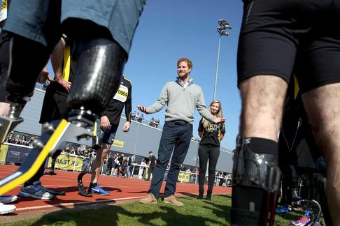 Britain's Prince Harry Patron of the Invictus Games Foundation, speaks to competitors as he attends 