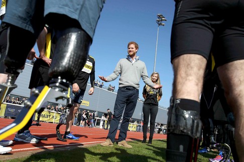 Britain's Prince Harry Patron of the Invictus Games Foundation, speaks to competitors as he attends 