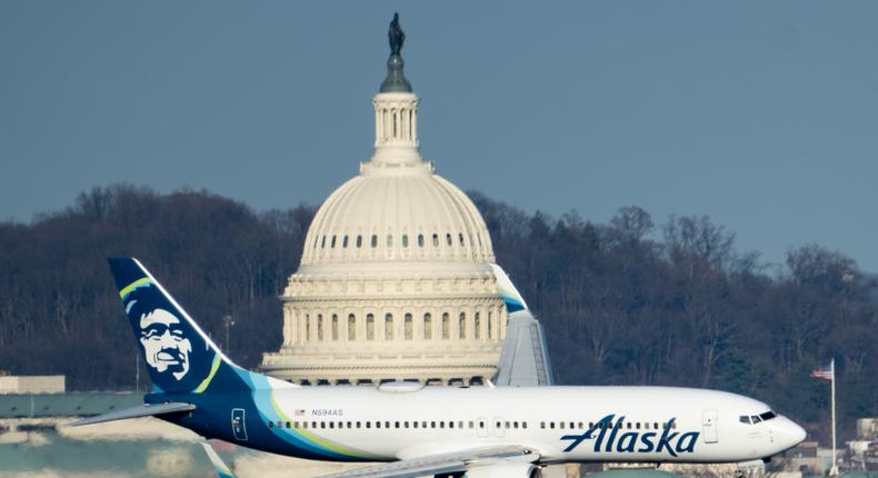 An Alaska Airlines Boeing 737-800 jet flies past the U.S. Capitol dome.Bill Clark/Getty
