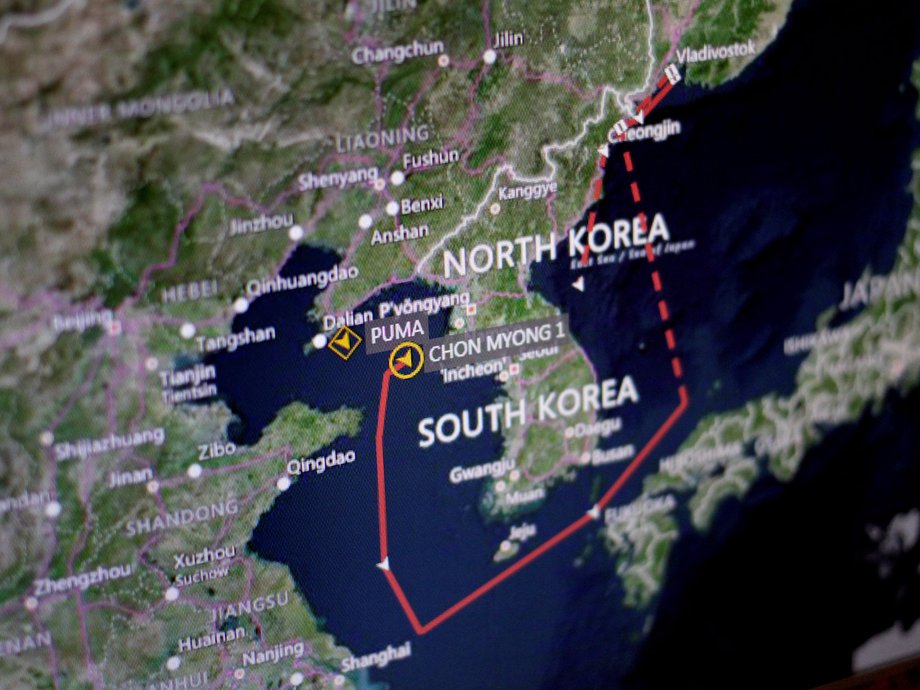 A ship-tracking screen shows one vessel's movement from Vladivostok, Russia, to Nanpo, North Korea.