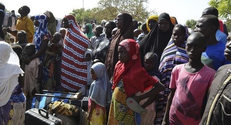 Families from Gwoza, Borno State, displaced by the violence and unrest caused by the insurgency, are pictured at a refugee camp in Mararaba Madagali, Adamawa State, February 18, 2014. REUTERS/Stringer