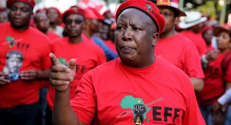 Leader of South Africa's left-wing Economic Freedom Fighters (EFF) Julius Malema gestures after arriving at the Johannesburg Stock Exchange (JSE) in Sandton, October 27, 2015. REUTERS/Siphiwe Sibeko
