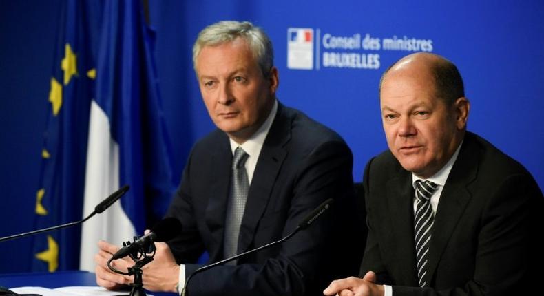 German Finance Minister Olaf Scholz (R) and his French counterpart Bruno Le Maire will present their tax proposal on Monday