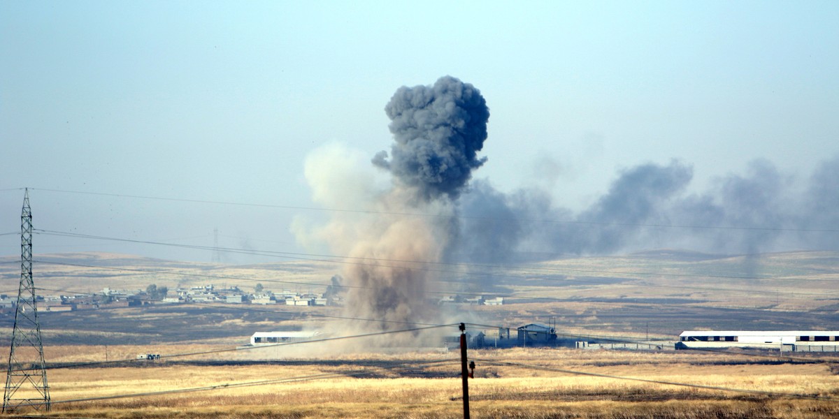 Smoke rises after airstrikes from the US-led coalition against Islamic State militants in a village east of Mosul, Iraq, May 29, 2016.