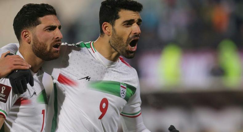 Forward Mehdi Taremi (R) celebrates his goal which sent Iran into the 2022 World Cup final with a 1-0 win over Iraq at the Azadi Sports Complex in Tehran. Creator: Atta KENARE