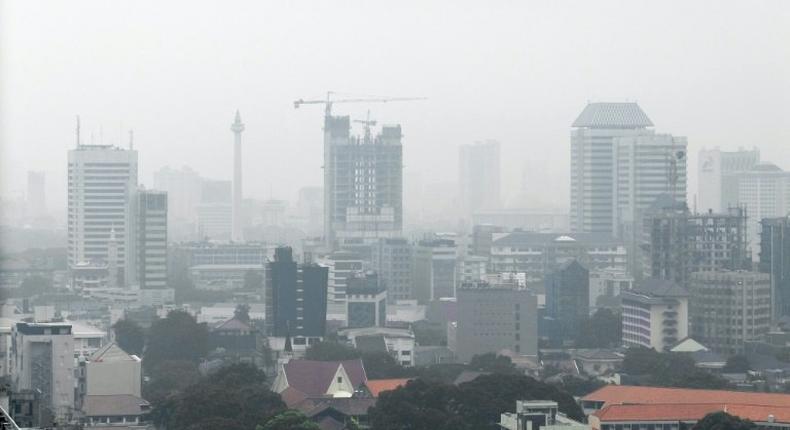 Haze caused by vehicle emissions hangs over Jakarta's skyline