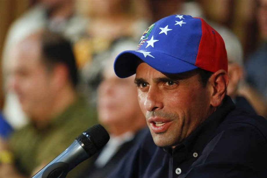 Venezuela's opposition leader and governor of Miranda state, Henrique Capriles, answers a question during a news conference in Caracas.