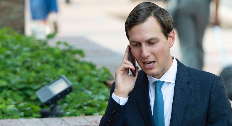 Jared Kushner, White House Senior Advisor, talks on his cellphone as he arrives for trade talks at the office of the US Trade Representative in Washington, DC, August 29, 2018.