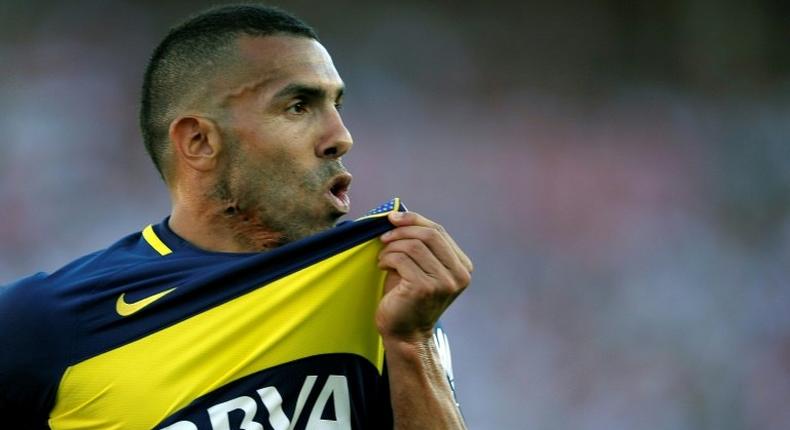 Boca Juniors' forward Carlos Tevez celebrates after scoring on December 11, 2016