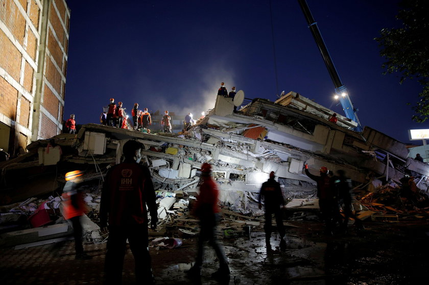 Rescue operations take place on a site after an earthquake struck the Aegean Sea, in the coastal pro