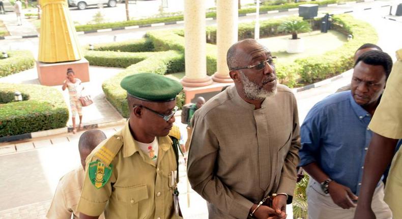 PDP spokesman, Olisa Metuh arrives Abuja court in handcuffs on January 19, 2016.