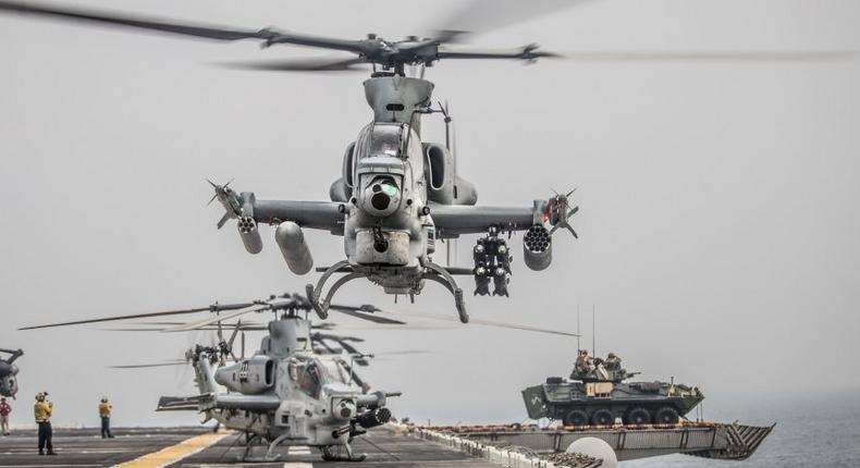 An AH-1Z Viper attached to Marine Medium Tiltrotor Squadron (VMM) 163 (Reinforced), 11th Marine Expeditionary Unit (MEU) takes off during a strait transit aboard the amphibious assault ship USS Boxer (LHD 4)