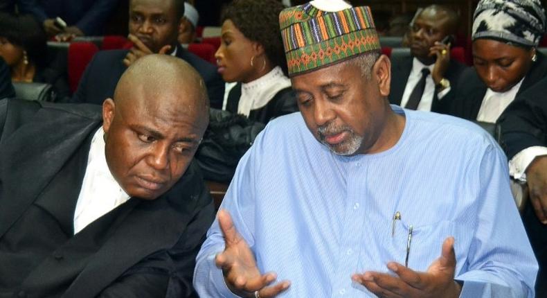 Former national security adviser Sambo Dasuki (R) allegedly oversaw a sprawling embezzlement scheme that saw phantom contracts awarded for personal gain, as under-equipped troops fought better-armed militants