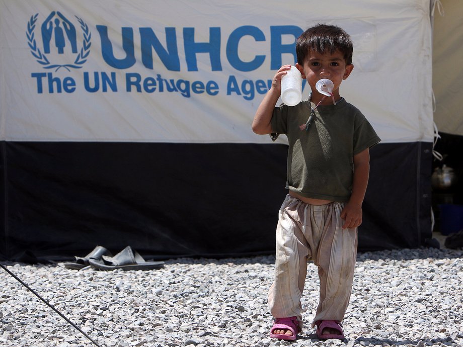 An Iraqi child, who fled from Mosul due to Islamic State violence, stands at a refugee camp in the Makhmour area near Mosul, Iraq, August 6, 2016.