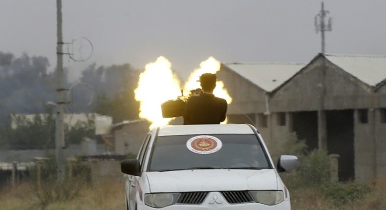 Fighters loyal to the Libyan internationally-recognised Government of National Accord fire a heavy machinegun during clashes against forces loyal to strongman Khalifa Haftar, on May 21, 2019 in the Salaheddin area south of the Libyan capital Tripoli