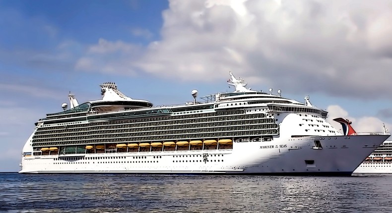 Royal Caribbean's Mariner of the Seas and a Carnival Cruise ship anchored off the shore of Grand Cayman Island.MyLoupe/Universal Images Group via Getty Images