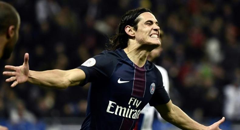 Paris Saint-Germain's Uruguayan forward Edinson Cavani reacts after scoring a goal during the French L1 football match between Olympique Lyonnais and Paris Saint-Germain on November 27, 2016