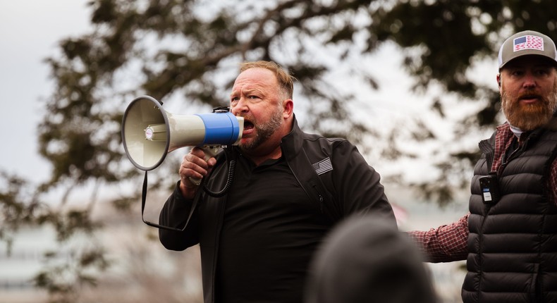 Alex Jones addresses a crowd of pro-Trump protesters after they stormed the grounds of the Capitol Building on January 6, 2021 in Washington, DC.