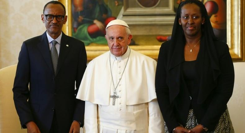 Pope Francis (centre) poses with Rwanda's President Paul Kagame and his wife Jeannette Kagame ahead of a meeting at the Vatican March 20, 2017