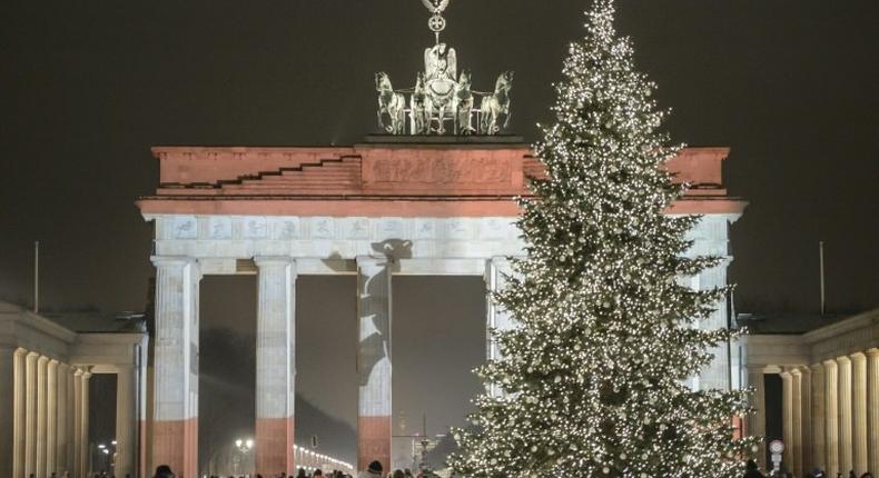 The Brandenburg Gate is seen illuminated in the colors of the flag of Berlin during a rehearsal ahead of the official remembrance ceremony in Berlin on December 20, 2016, a day after a terror attack on a Christmas market