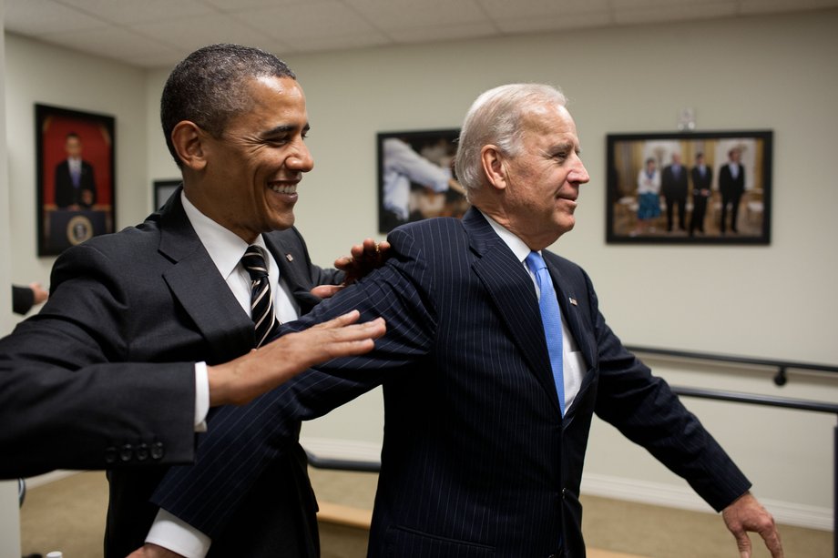 Obama jokes with Biden backstage before the STOCK Act signing event in the Eisenhower Executive Office Building South Court Auditorium, April 4, 2012.