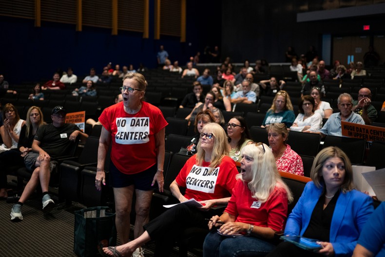 Residents holler at developers during a meeting to discuss a proposed AI data center in Upper Merion Township, Pennsylvania.Joe Lamberti for BI