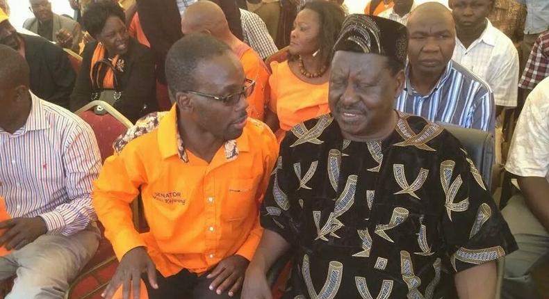 File image of former Prime Minister Raila Odinga with Homa Bay Senator Moses Kajwang