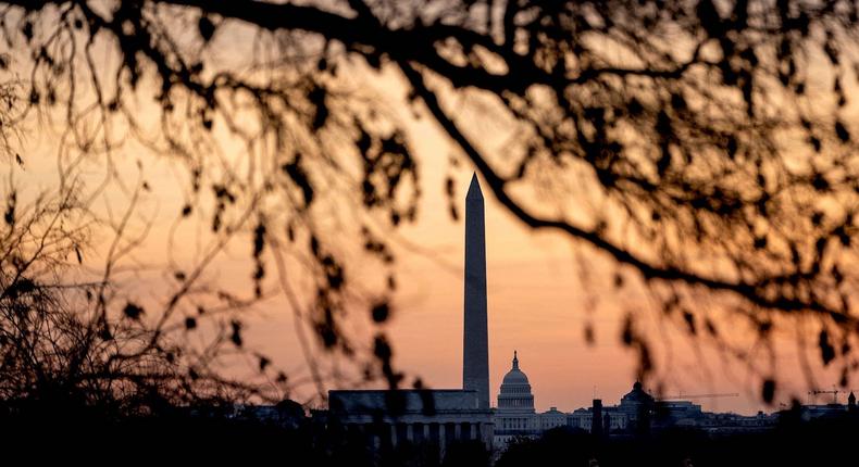 The Lincoln Memorial, Washington Monument, and US Capitol at sunrise in Washington, DC, on January 16, 2022, ahead of a winter storm