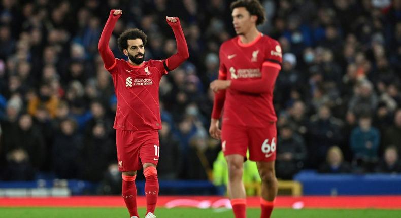 Derby delight: Mohamed Salah (left)scored twice as Liverpool beat Everton