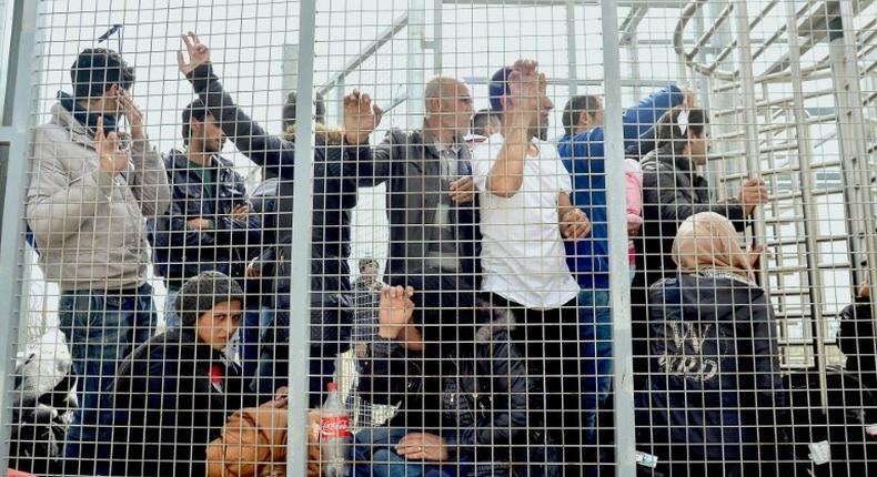 Migrants wait to enter the Hungarian transit zone near the border with Serbia in April 2016