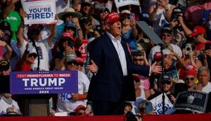 Former president Donald Trump was photographed moments before shots rang out at a rally in Pennsylvania on Saturday.Jeff Swensen/Getty Images