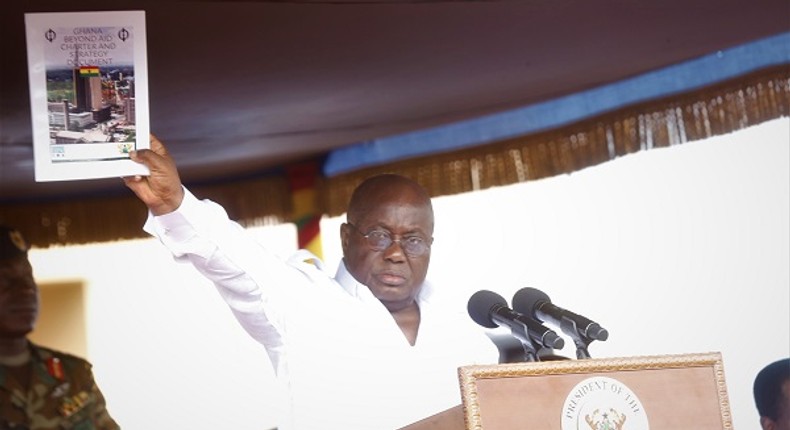 President Nana Addo Dankwa Akufo-Addo displaying the Ghana Beyond Aid document at the May Day celebrations in Accra